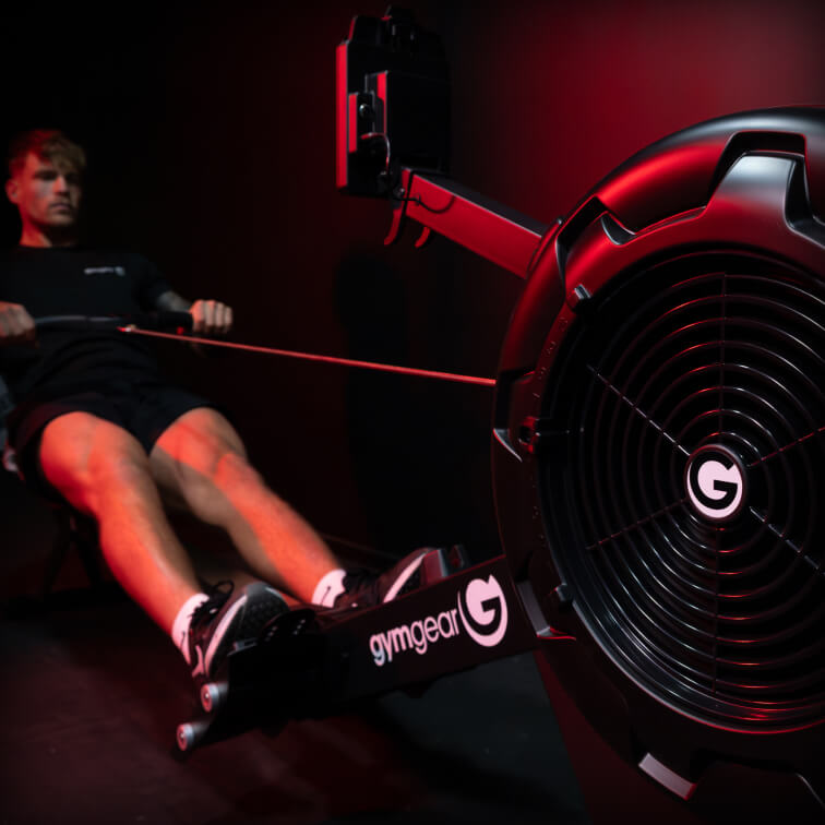 Man on Gym Gear rowing machine