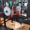 Woman lifting olympic barbell