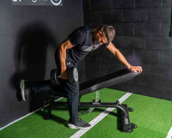 Urethane Dumbbell In Use Bent Over Row on Adjustable Bench