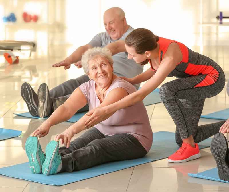 Stronger for longer - an older gym member receives instruction